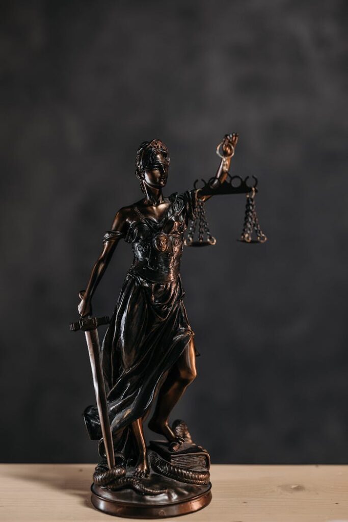pexels-photo-8112193 Close-up Photo of a Lady Justice Statuette